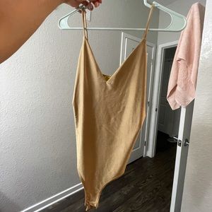 Silky shiny gold bodysuit